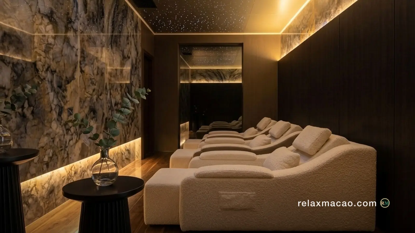 Recliner lounge at a Macau spa, warm lamplight across dark upholstery
